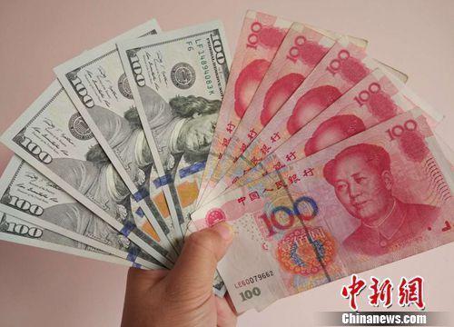 資料圖：人民幣和美元。<a target='_blank'  _fcksavedurl='http://www.chinanews.com/' ></table>中新網(wǎng)</a>記者 李金磊 攝